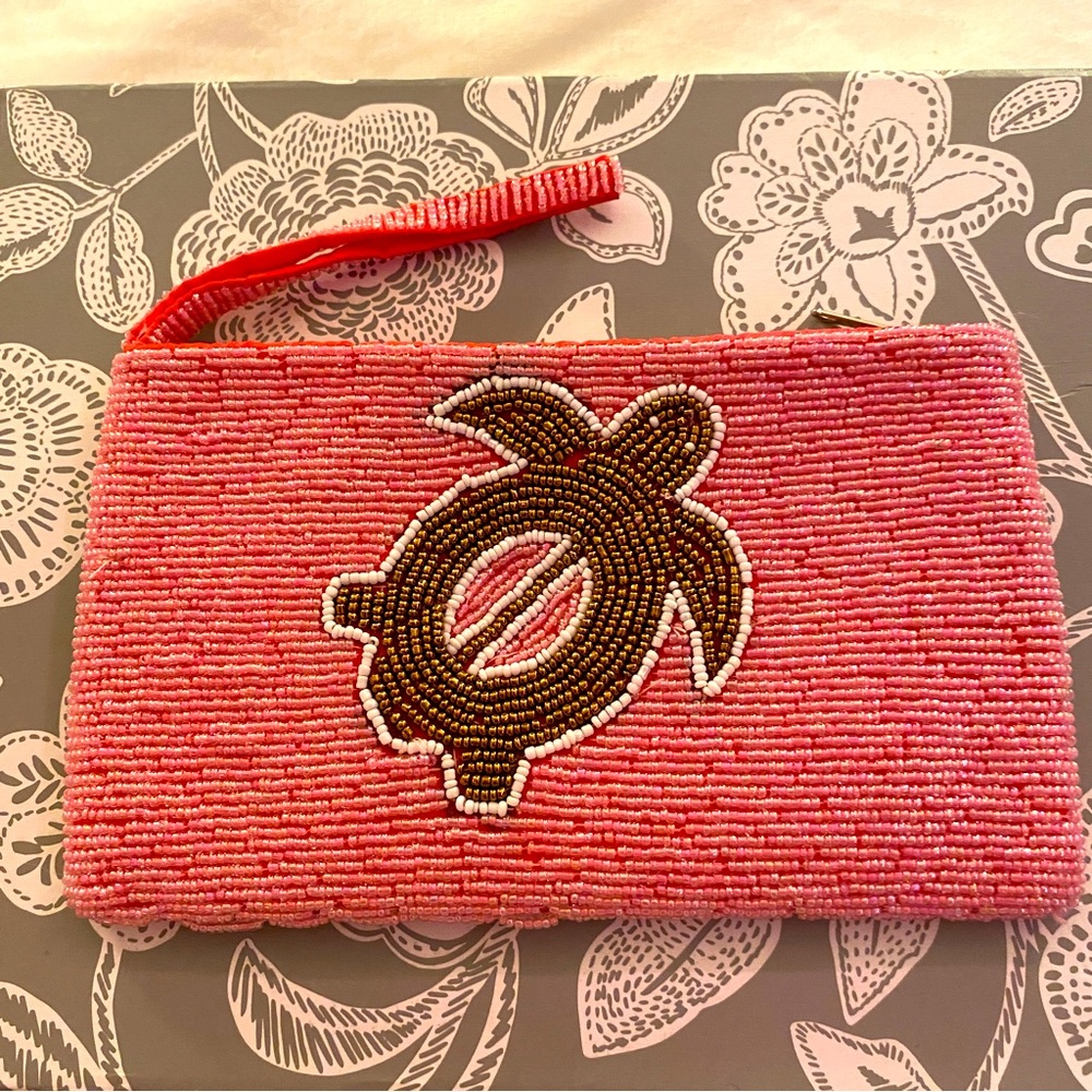 Pink beaded clutch with turtle